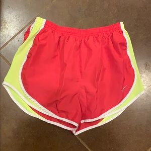 Pink and yellow Nike women’s tempo running shorts
